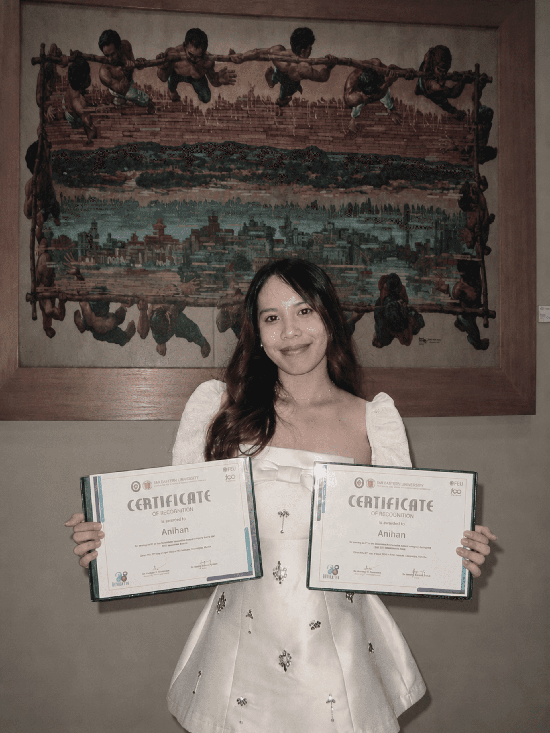 Shaenna holding her ANIHAN business plan project awards